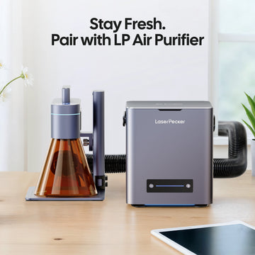 LaserPecker laser engraver paired with the LP Air Purifier, connected via a hose to remove smoke and fumes, with the slogan "Stay Fresh. Pair with LP Air Purifier".