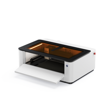 LaserPecker LX2 all-in-one laser cutter with front door open, showing internal workspace