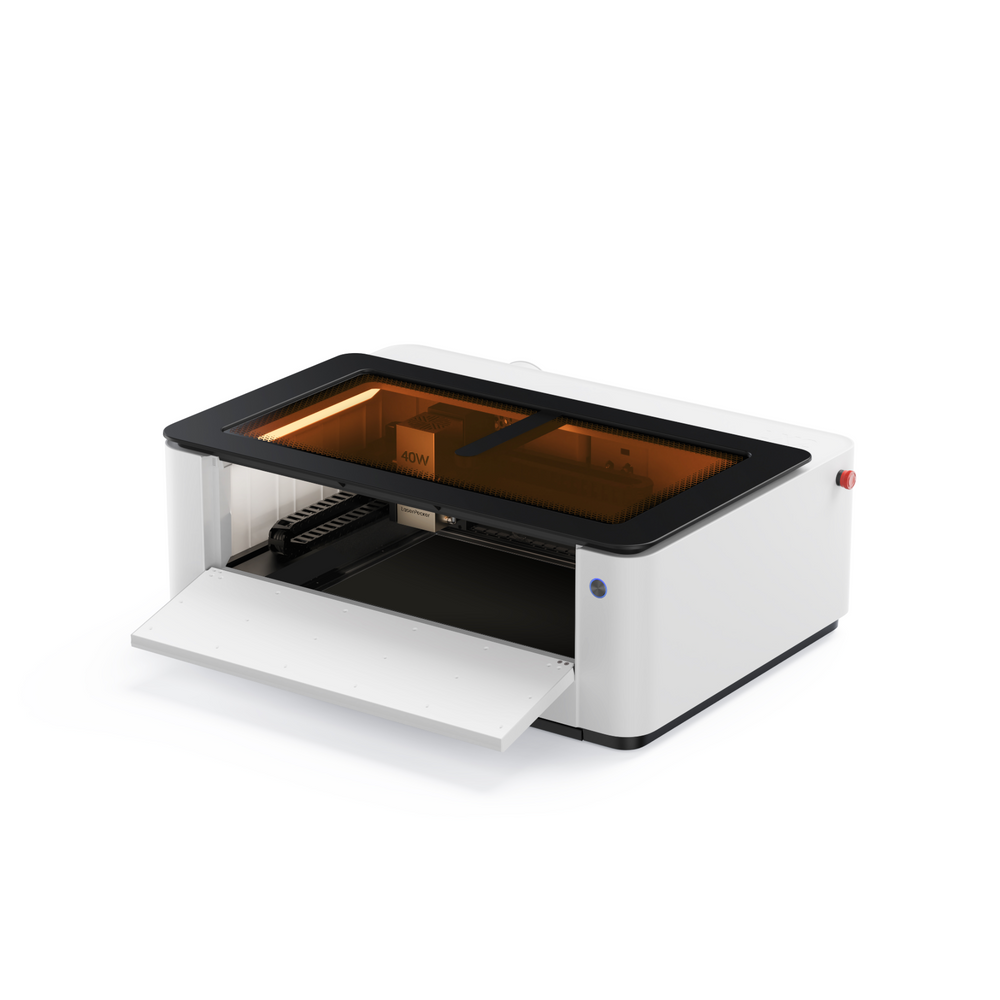 LaserPecker LX2 all-in-one laser cutting machine with front door open, showing internal workspace.