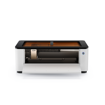LaserPecker LX2 all-in-one laser cutter with front door open, showing 40W laser module and rotating engraving attachment
