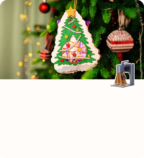 A handcrafted wooden Christmas ornament with a colorful tree design hanging on a decorated Christmas tree.