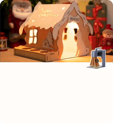 Illuminated handcrafted holiday decor shaped like a snow-covered house.