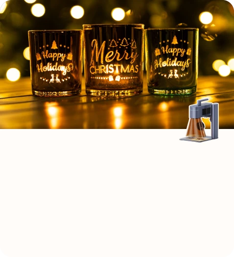 A set of custom engraved drinking glasses showcasing Merry Christmas and Happy Holidays designs.