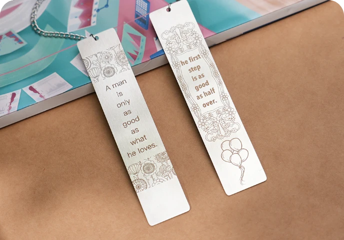 Two wooden bookmarks.