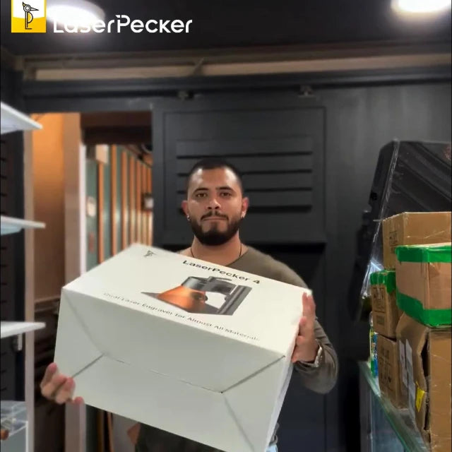 Man engraving brand logos on objects with the LaserPecker LP4.
